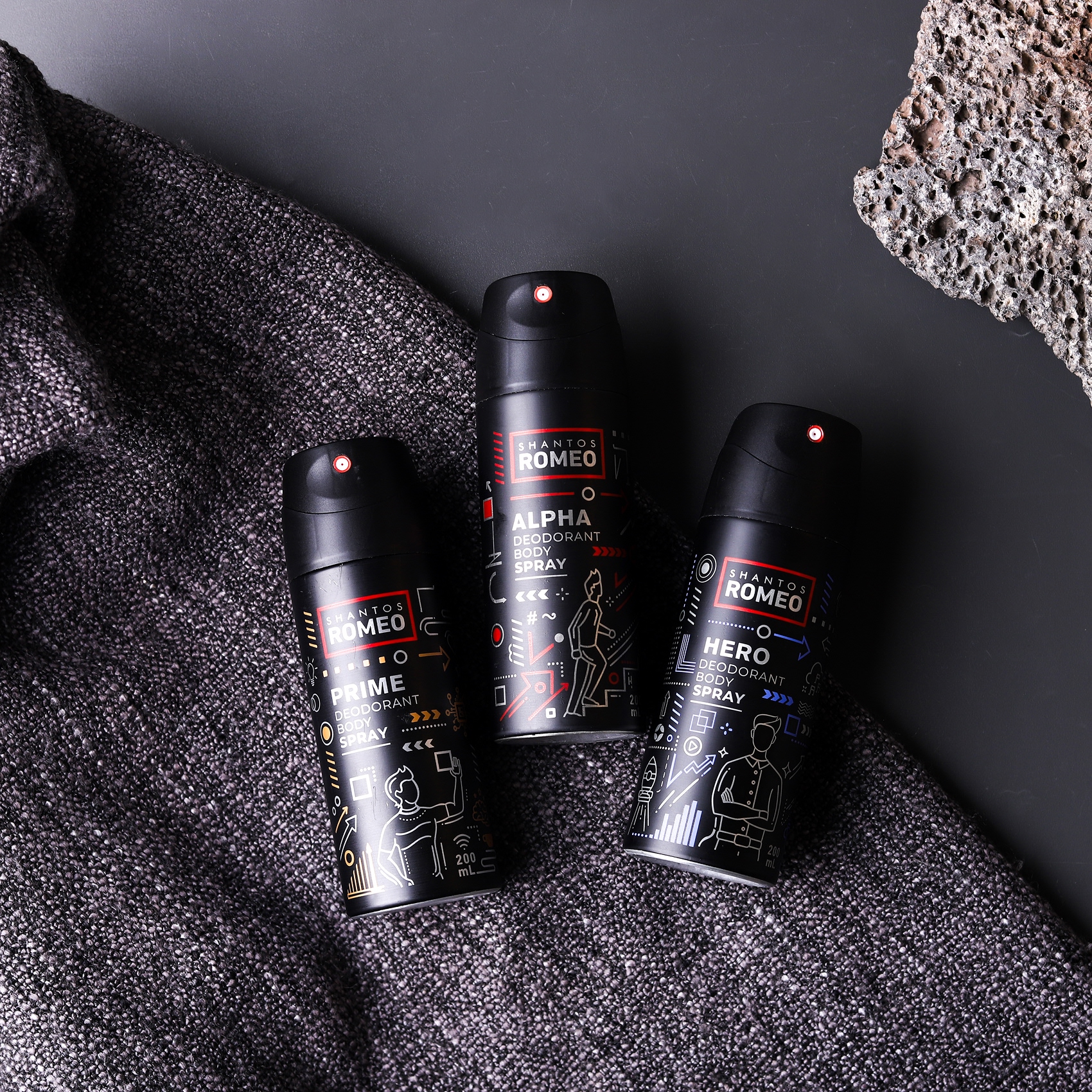 “Flat lay Shantos Romeo Body Spray Prime, Alpha, Hero di atas karpet dengan aksen aroma”