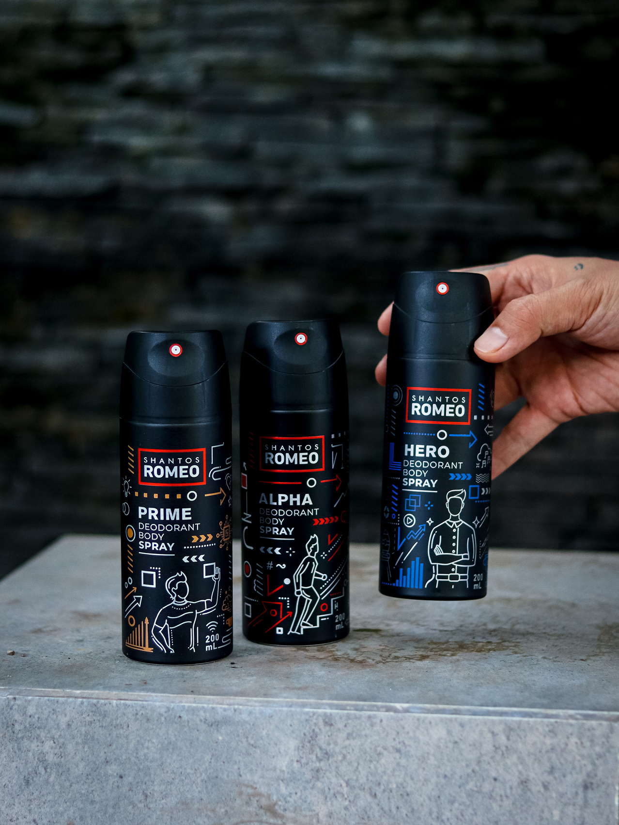 3 deo body spray shantos romeo : alpha, prime, hero. Disusun hampir sejajar diatas meja batu.