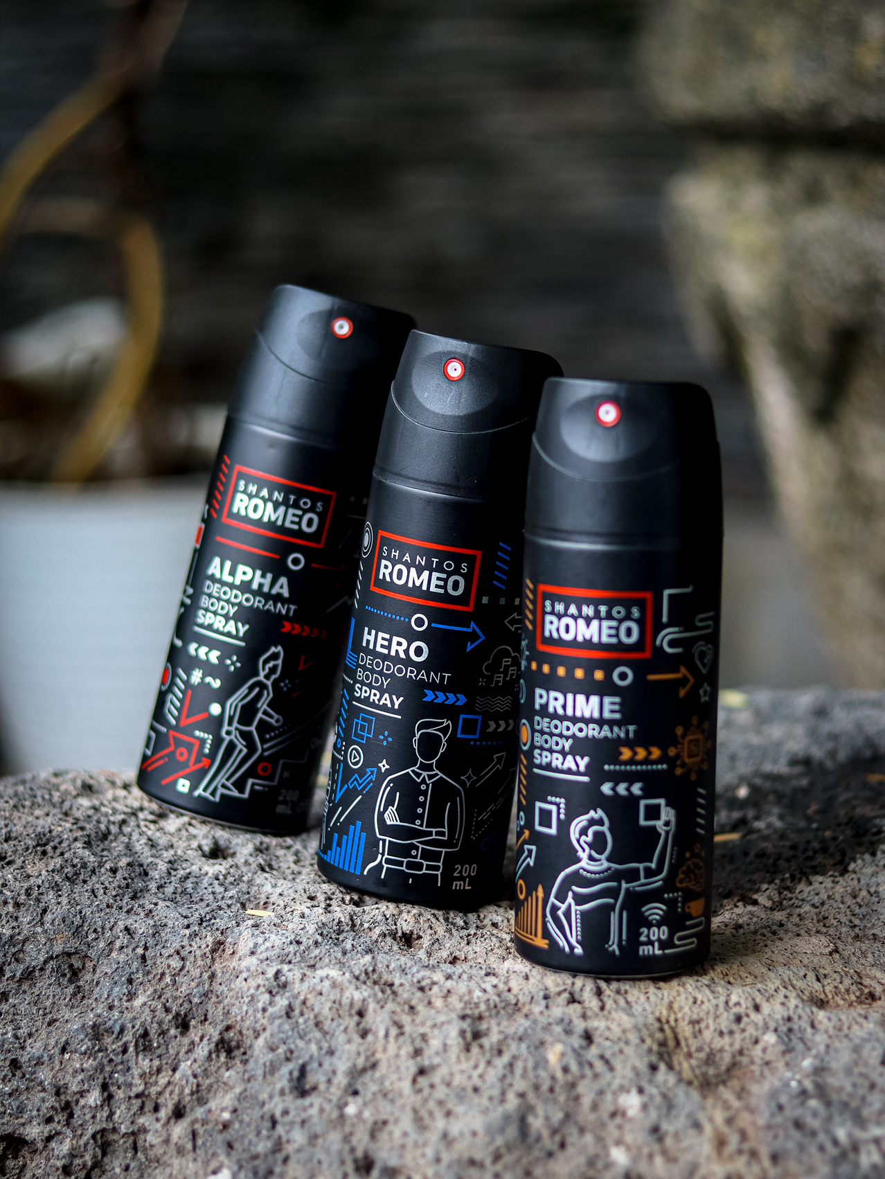 “Flat lay Shantos Romeo body sprays on Top of Stone with forest vibe background”