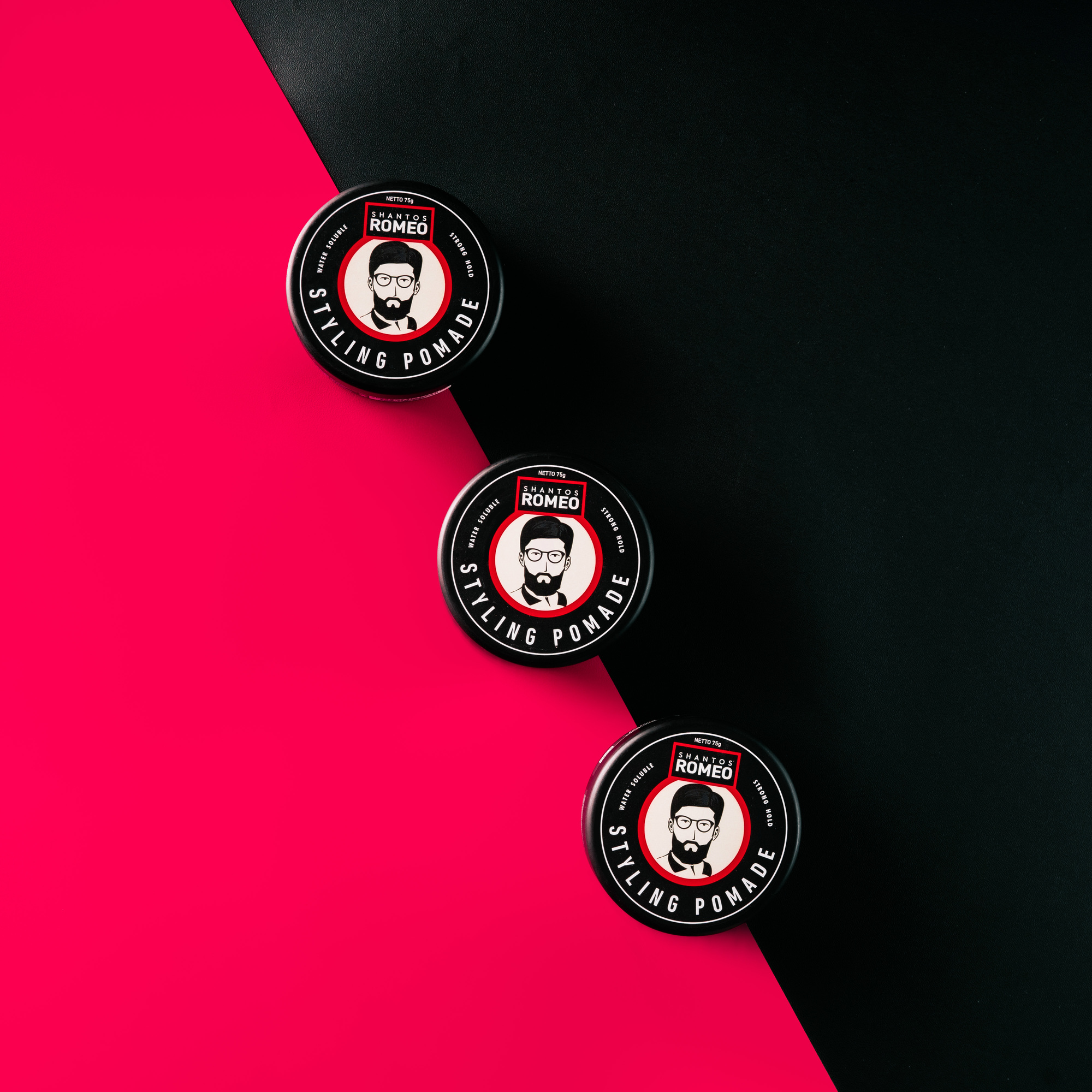 shantos romeo styling pomade on red and black